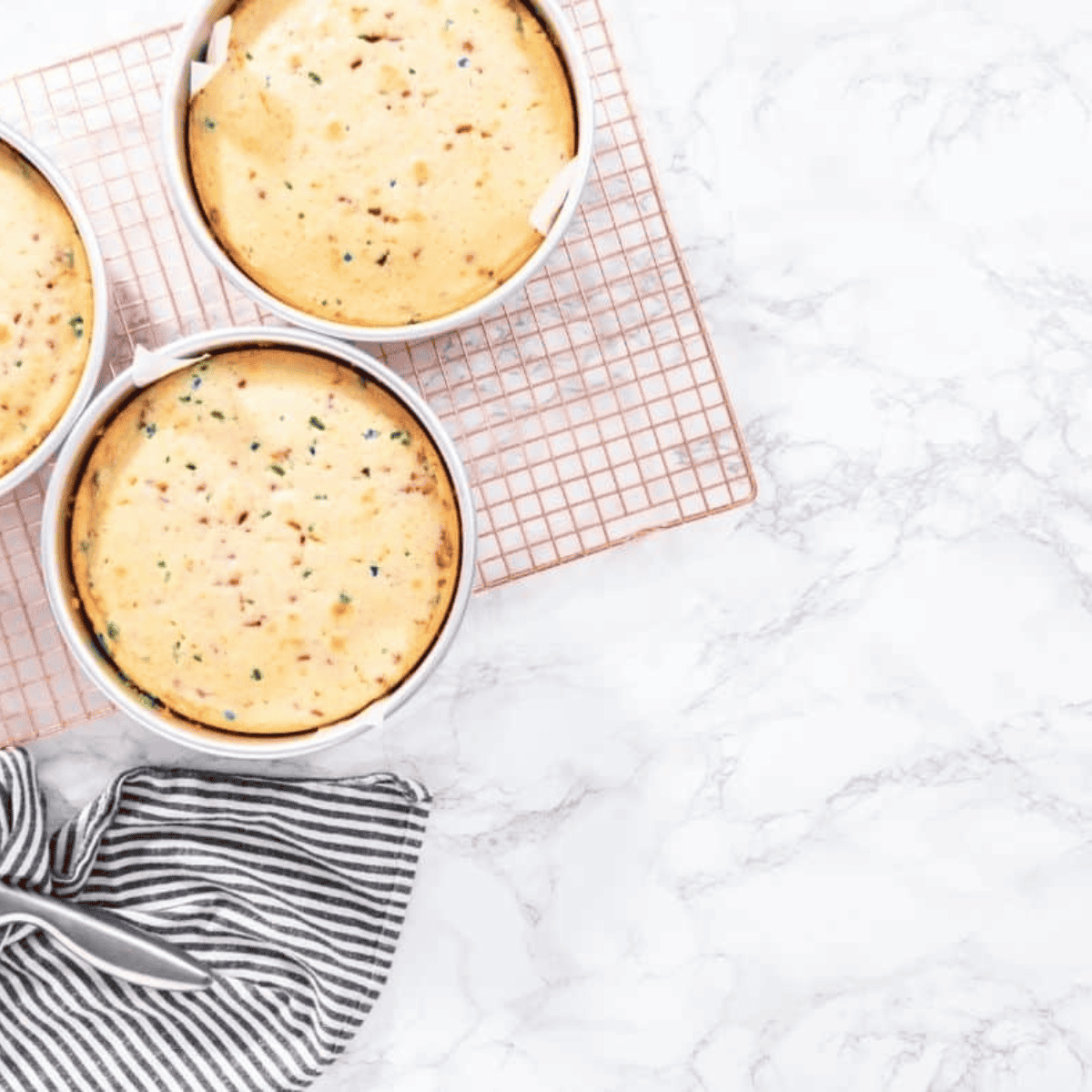 Cake batter poured into a greased pan, ready to cook in the air fryer until golden and fully baked