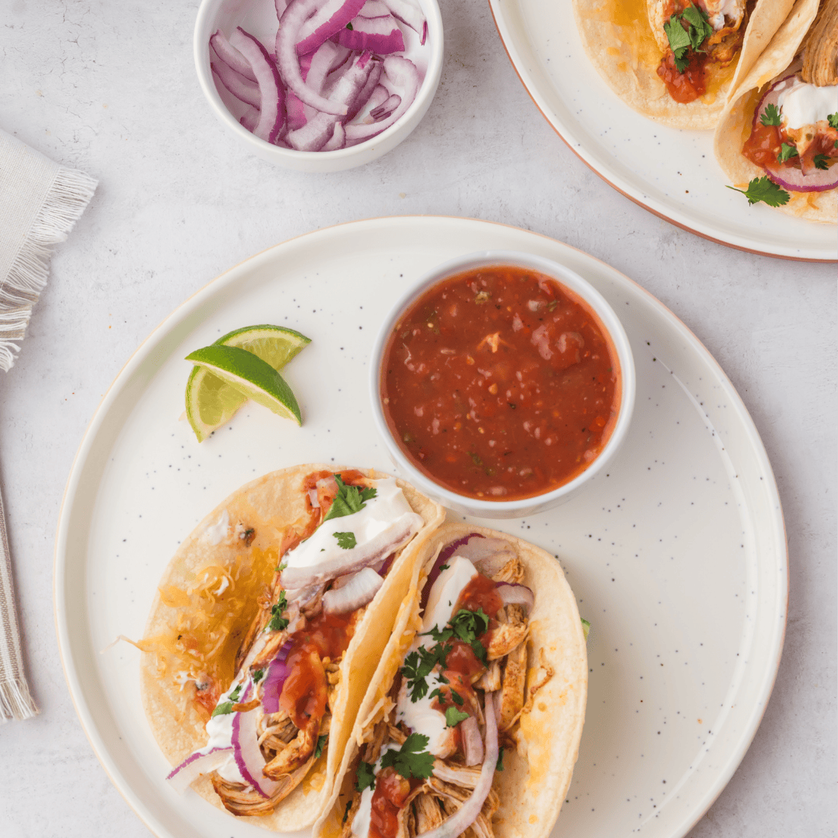 Air fryer shredded chicken tossed with taco seasoning and lime