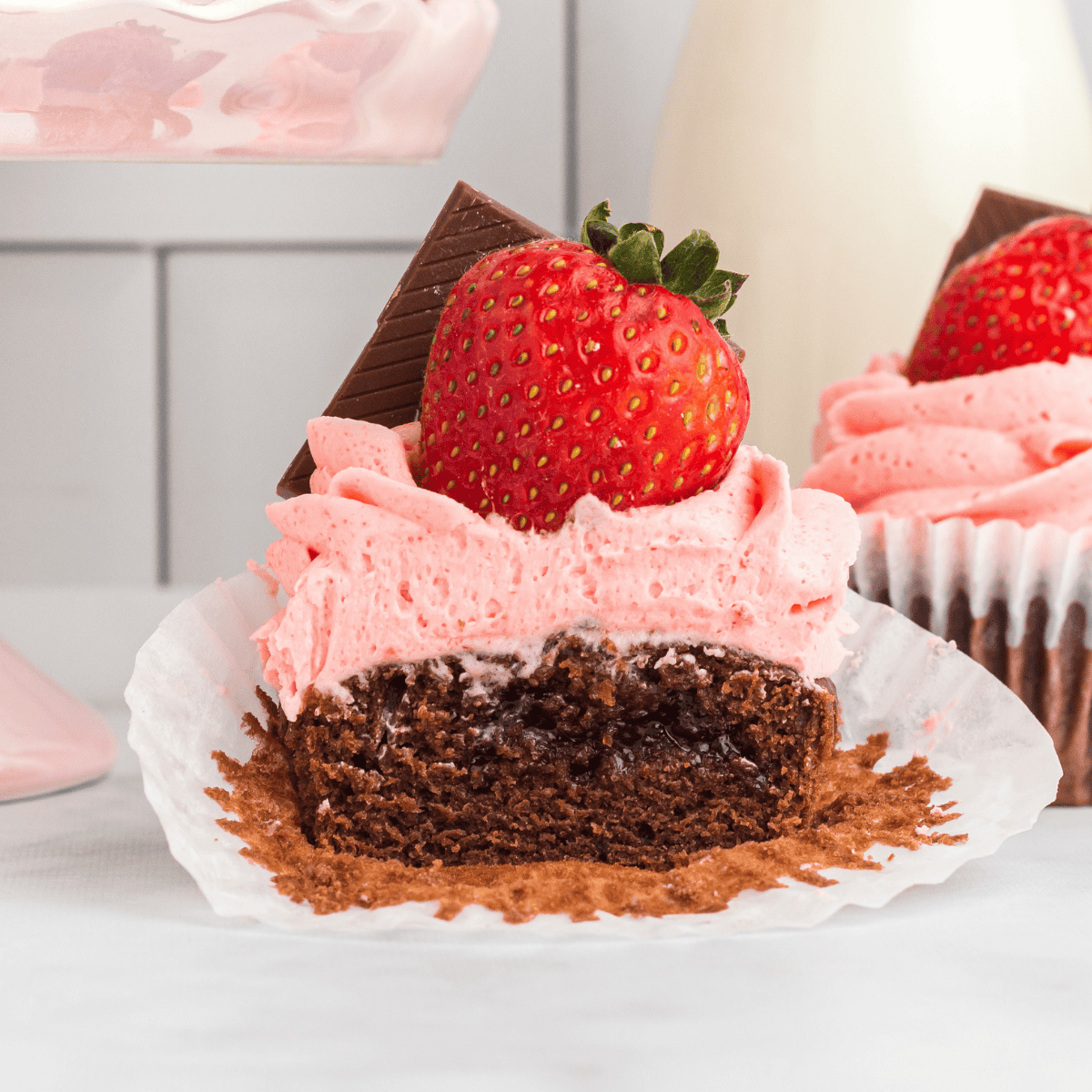 Air fryer Valentine cupcakes with pink and red frosting, decorated for Valentine’s Day.