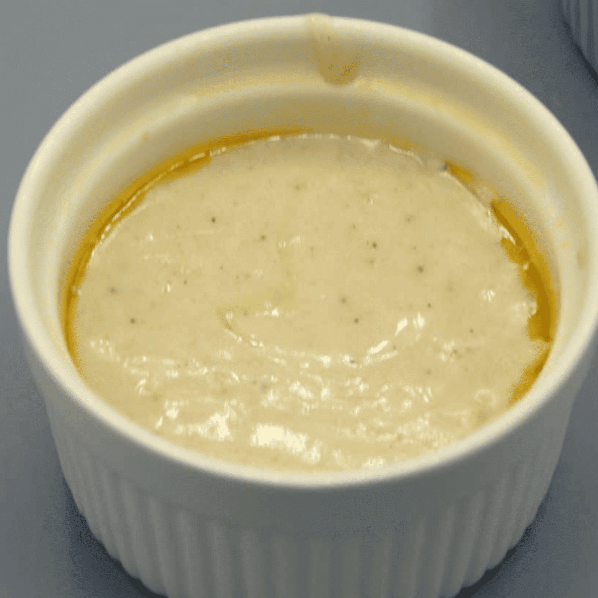 Mix dry and wet ingredients into batter, pour half into prepared ramekin, ready for air frying.