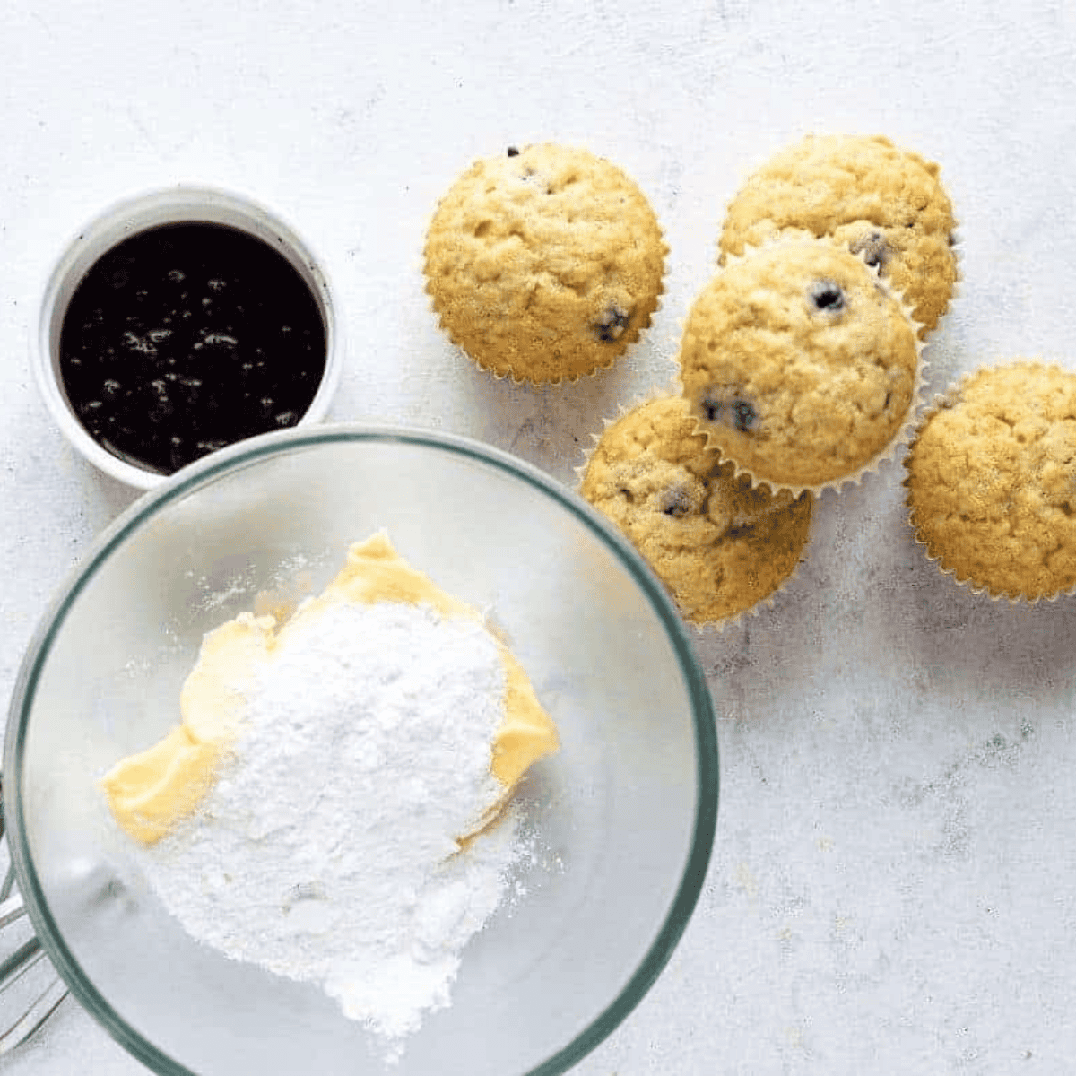 Creaming butter until light and fluffy, then gradually mixing in sugar in a large bowl.