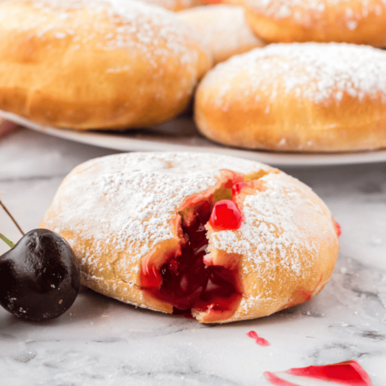 Golden air fryer cherry pie donuts with sweet cherry filling, freshly cooked and ready to serve.
