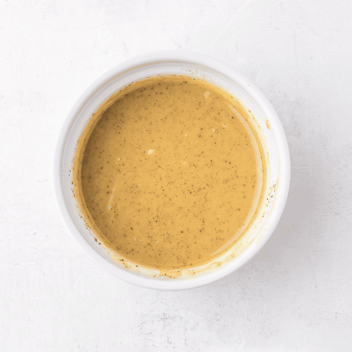 Whisking honey, soy sauce, and brown sugar together for copycat Applebee's honey pepper sauce