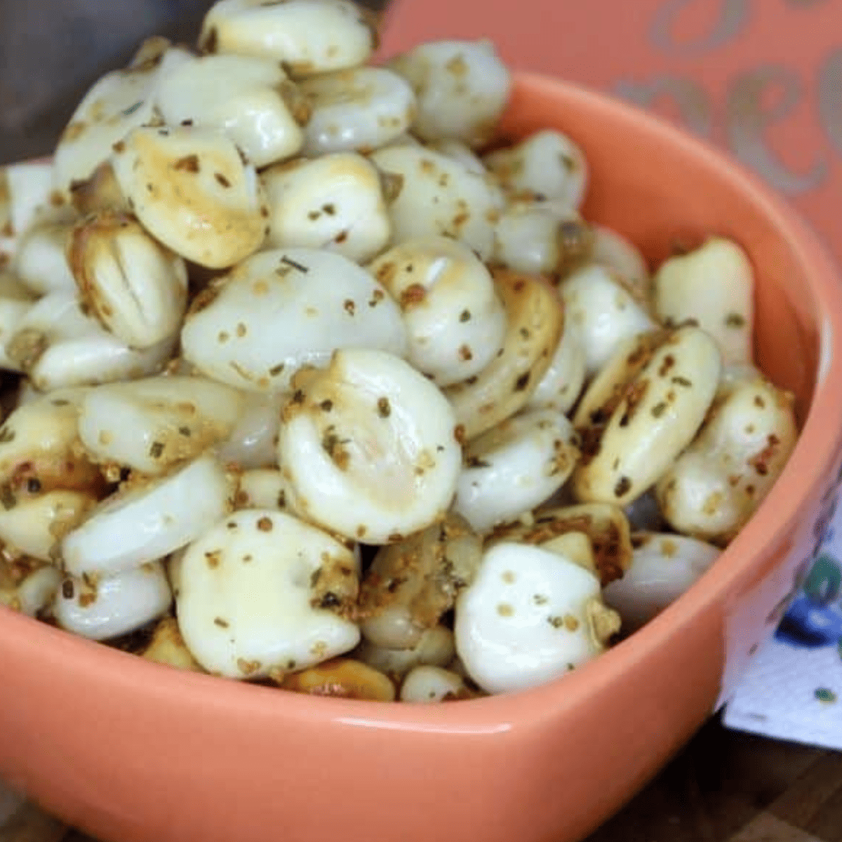 Cooling air fryer corn nuts on paper towel to finish crisping and setting texture before final seasoning and serving