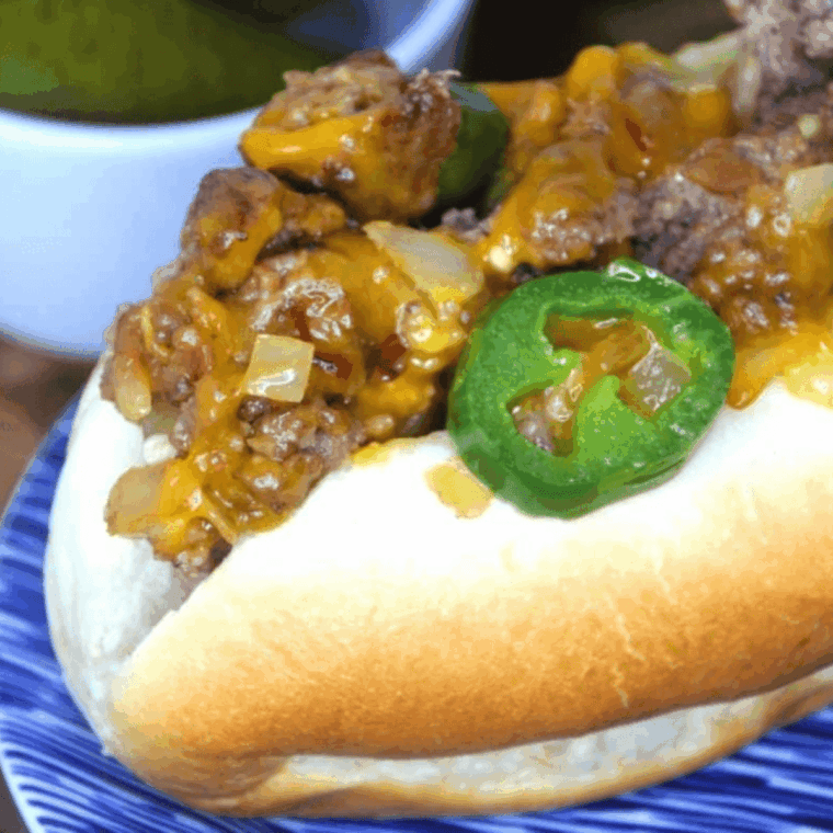 Air Fryer New York Style Chopped Cheese sandwich with chopped beef, melted cheese, onions, and jalapeños on a toasted roll