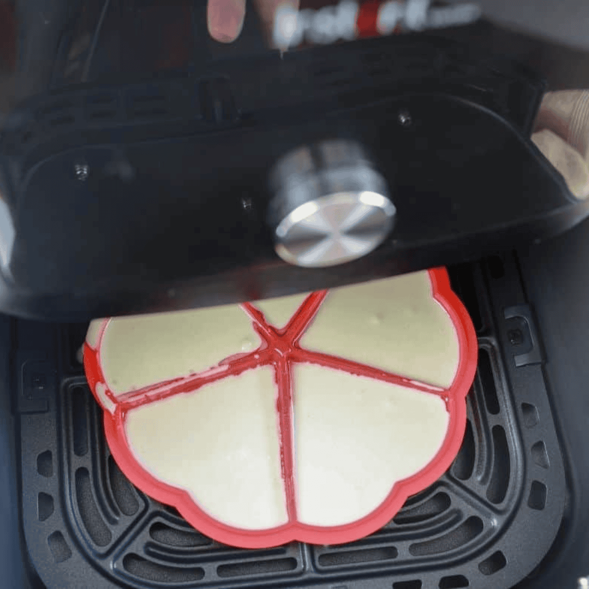 Lightly spray waffle molds with cooking spray, fill halfway, place in air fryer, and cook at 330°F for 6–8 minutes.