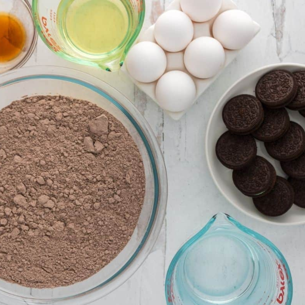 Ingredients needed for Air Fryer Mint Chocolate Cookies ‘n Creme Cake on kitchen table.