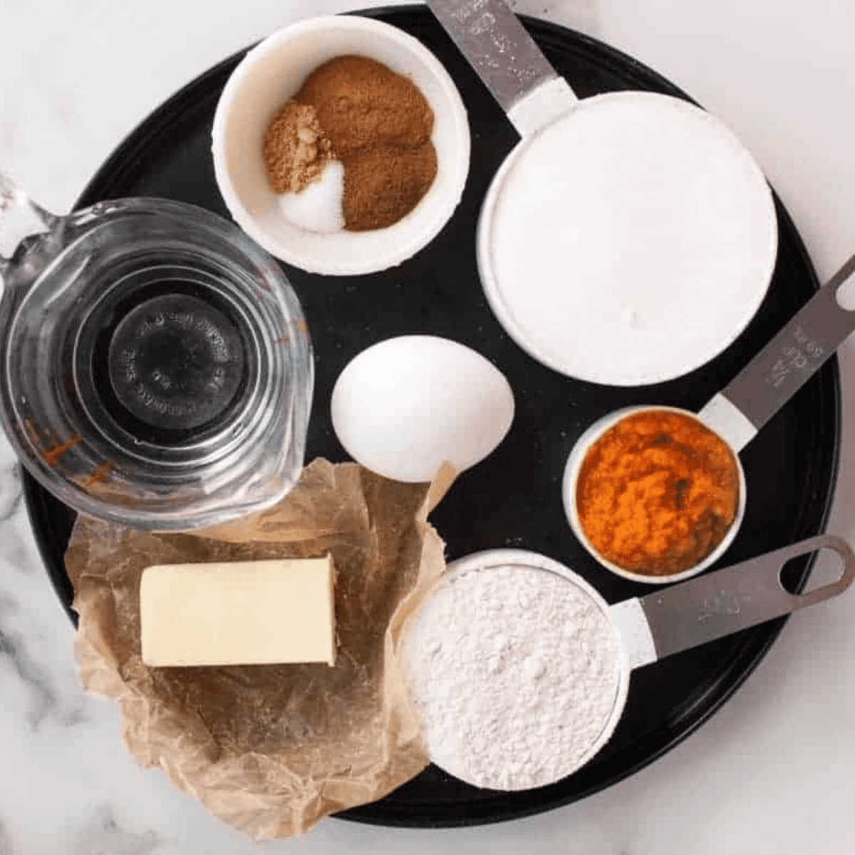 Ingredients needed for Air Fryer Pumpkin Churros laid out overhead on a counter