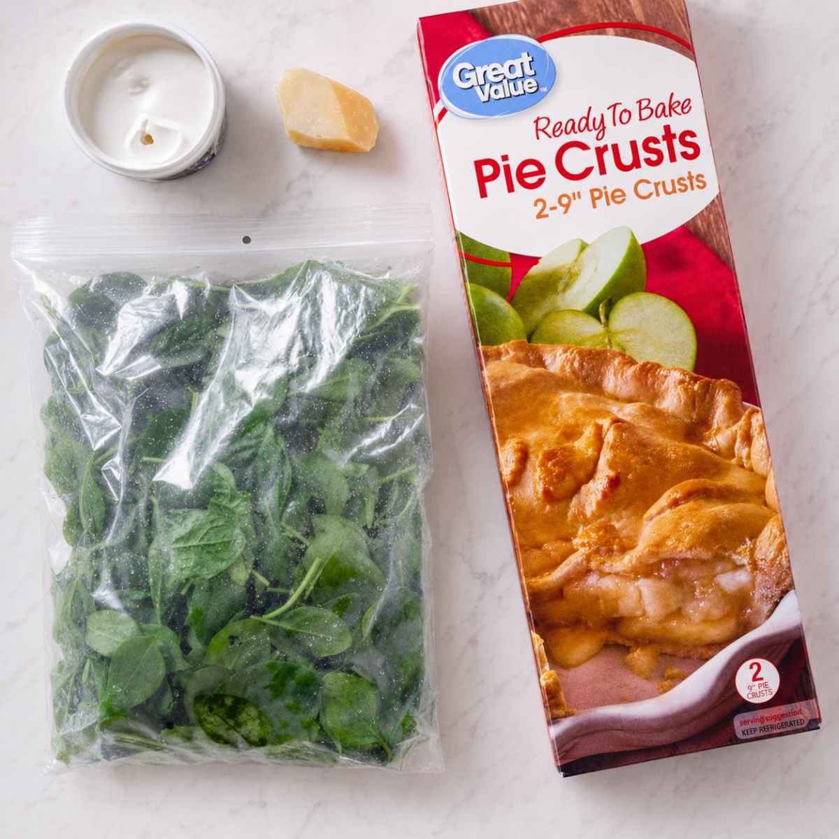 Ingredients for this recipe are refrigerated pie crust, butter, fresh spinach, egg, ricotta, and Parmesan