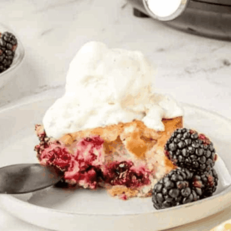 Air fryer blackberry cobbler with bubbling berries and golden topping