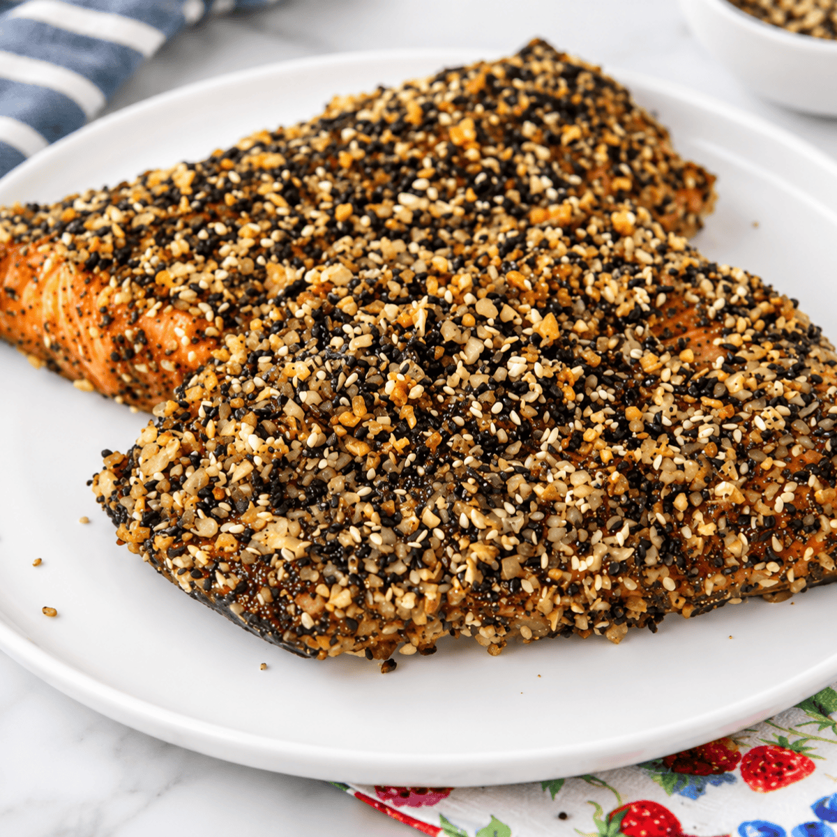 Patting salmon fillets dry with a paper towel before adding everything bagel seasoning