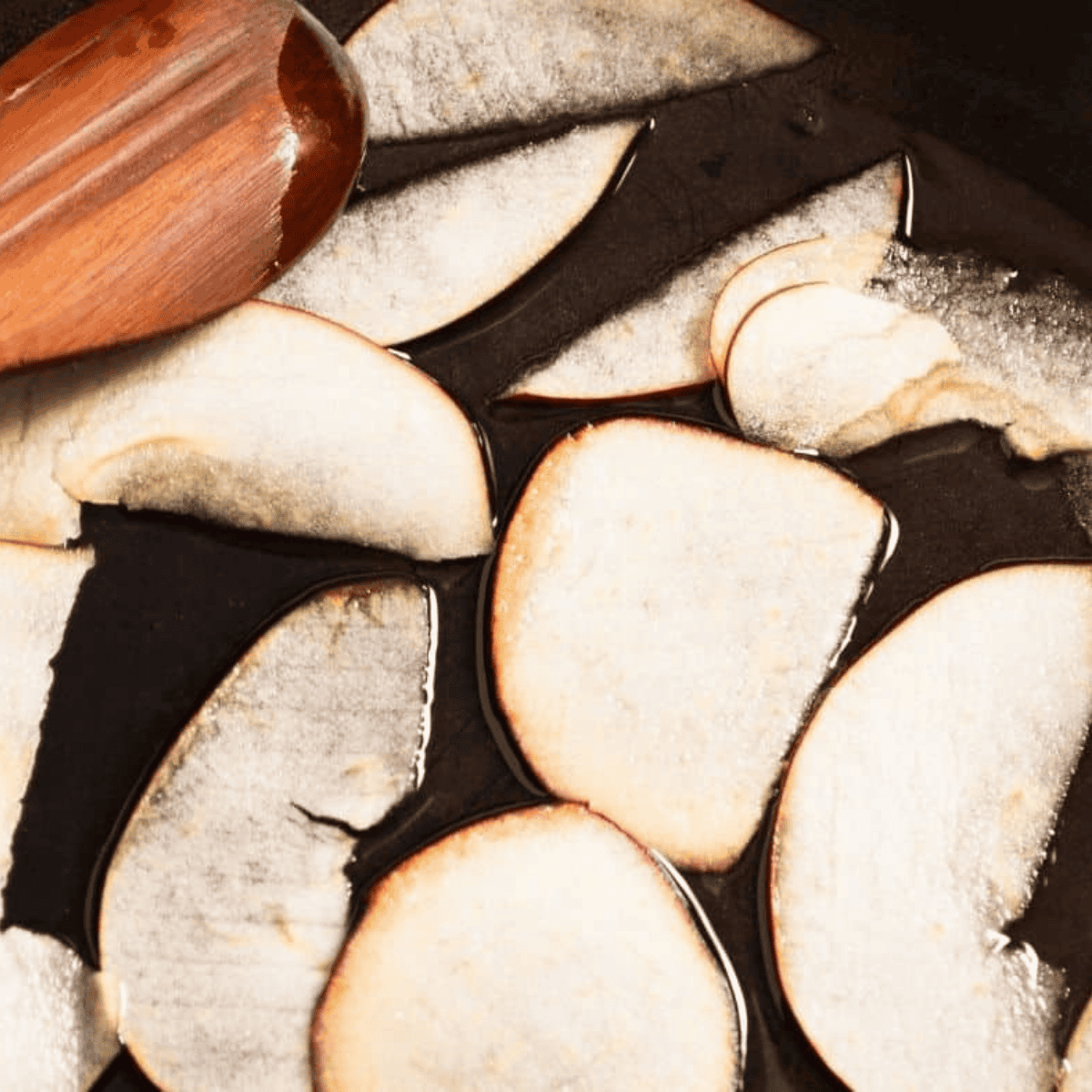 Softened apple slices after microwaving, pliable and ready to roll