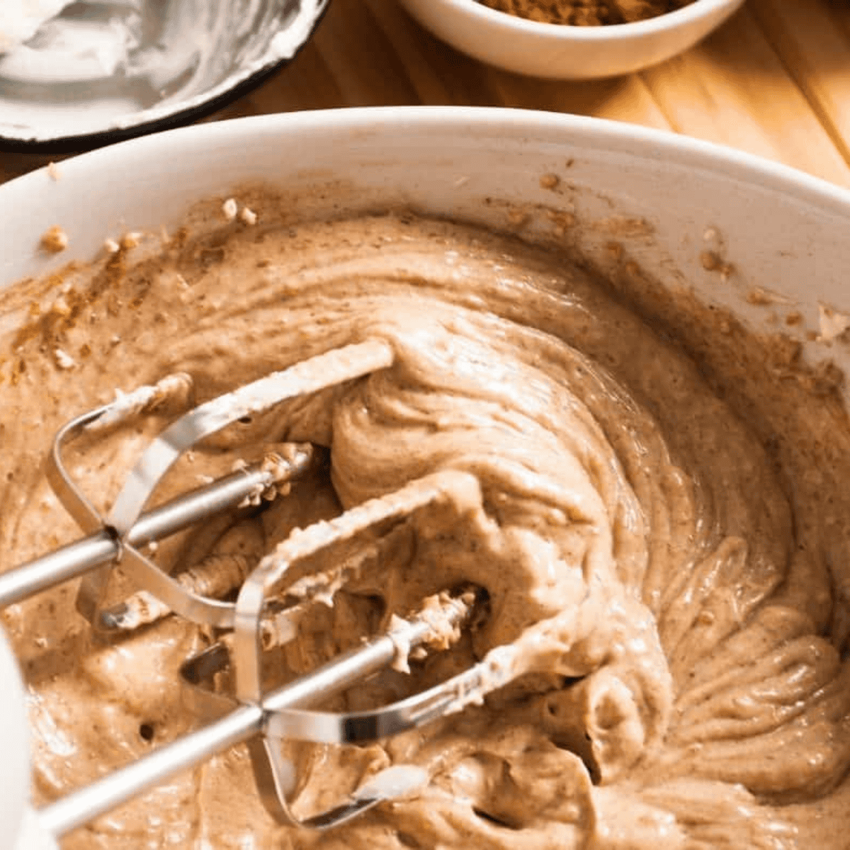 Cinnamon sugar and cream cheese filling mixed together in a bowl