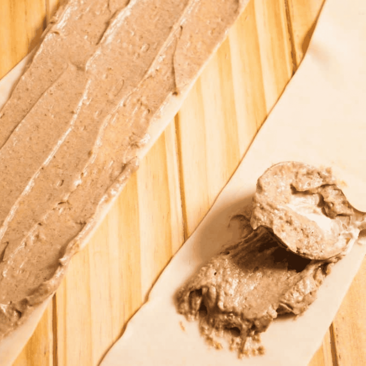 Puff pastry sheet cut into six strips and spread with cinnamon cream cheese