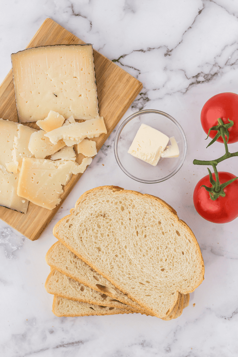 Ingredients needed for Air Fryer Spanish Manchego Grilled Cheese on kitchen table.