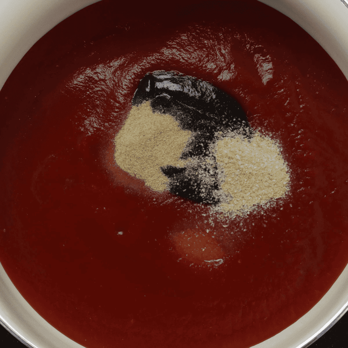 Hickory ketchup glaze for Boston Market meatloaf simmering in a small saucepan