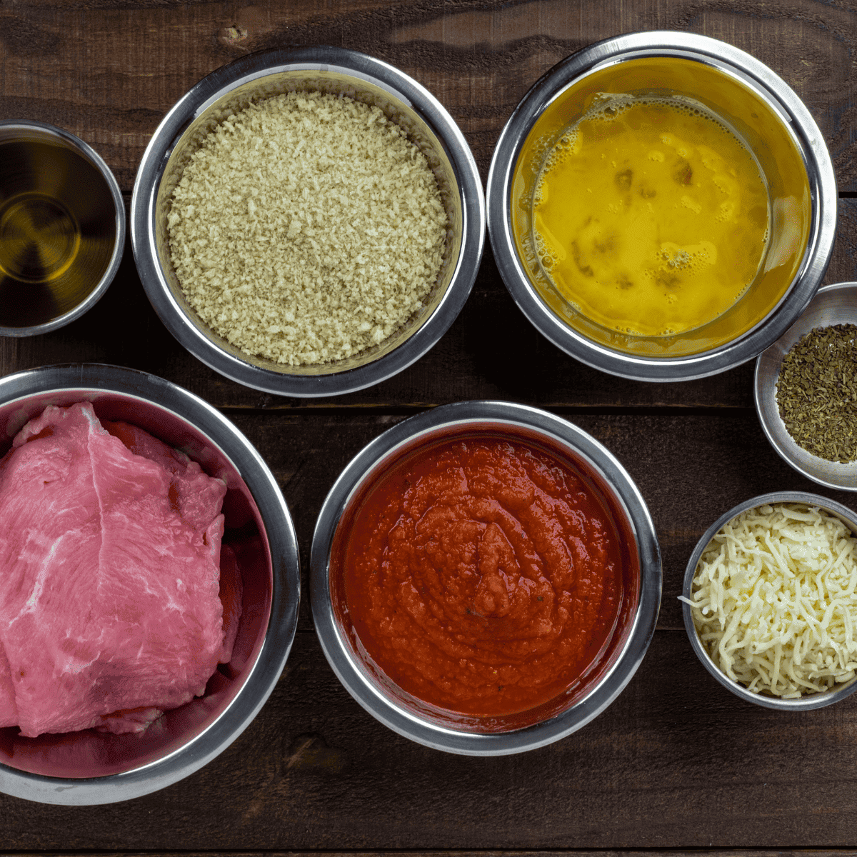 Ingredients needed for Easy Air Fryer Veal Parmesan on kitchen table.