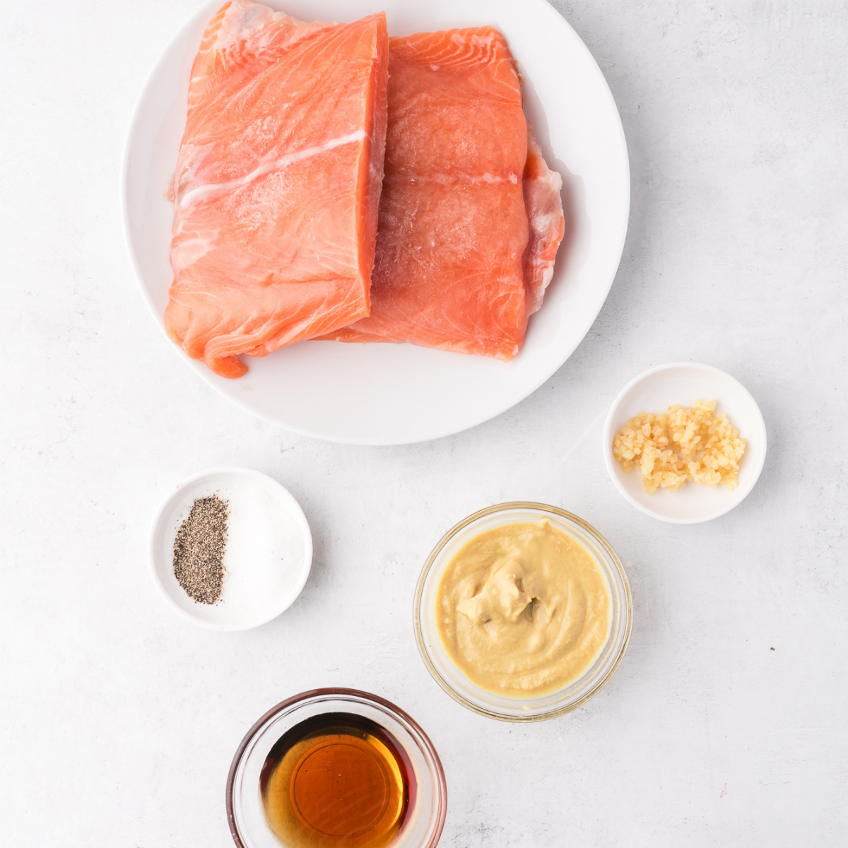 Ingredients needed for Air Fryer Salmon Burgers on kitchen table.