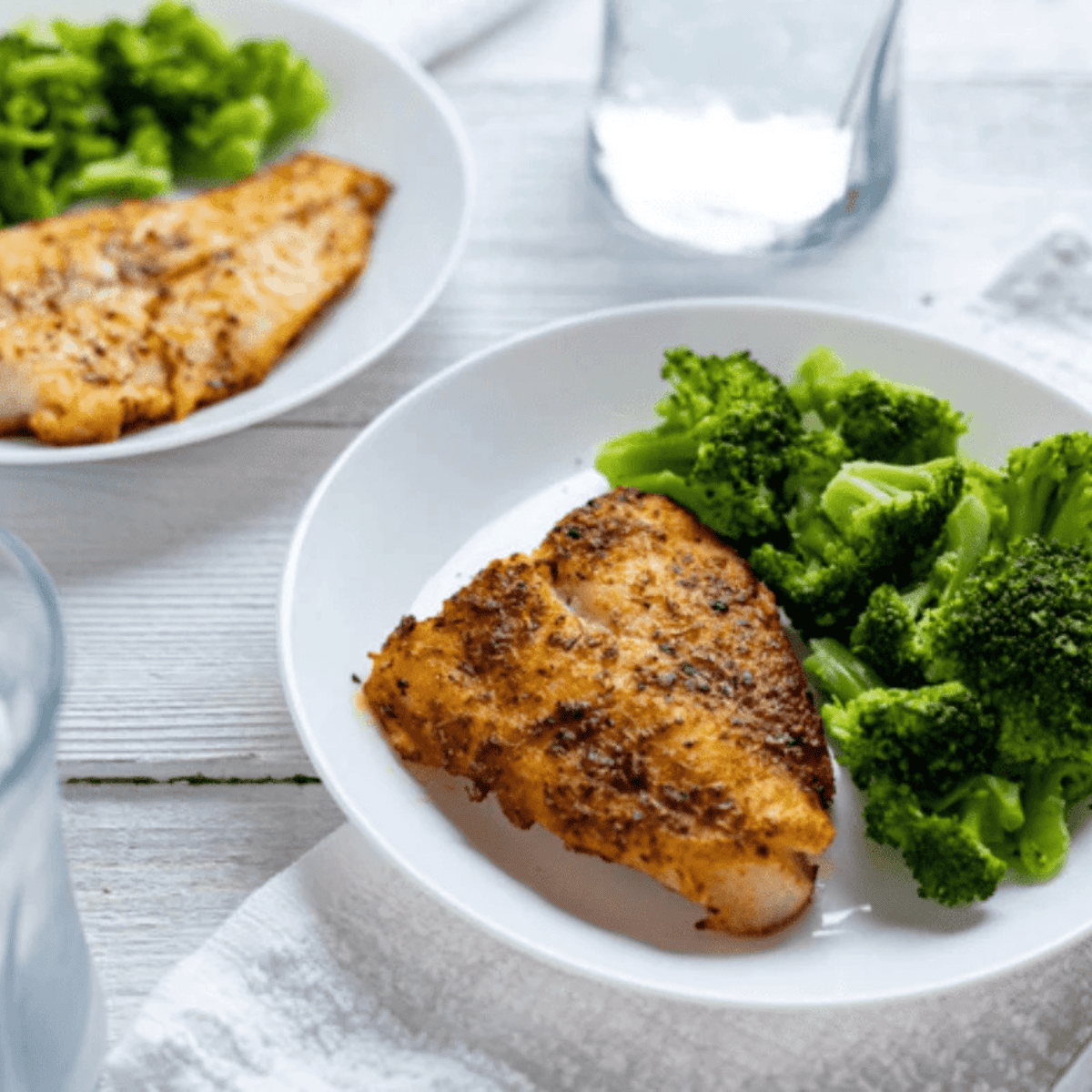 Air fryer swai fish fillets cooked until golden crispy outside and tender flaky inside served as a healthy easy dinner plate
