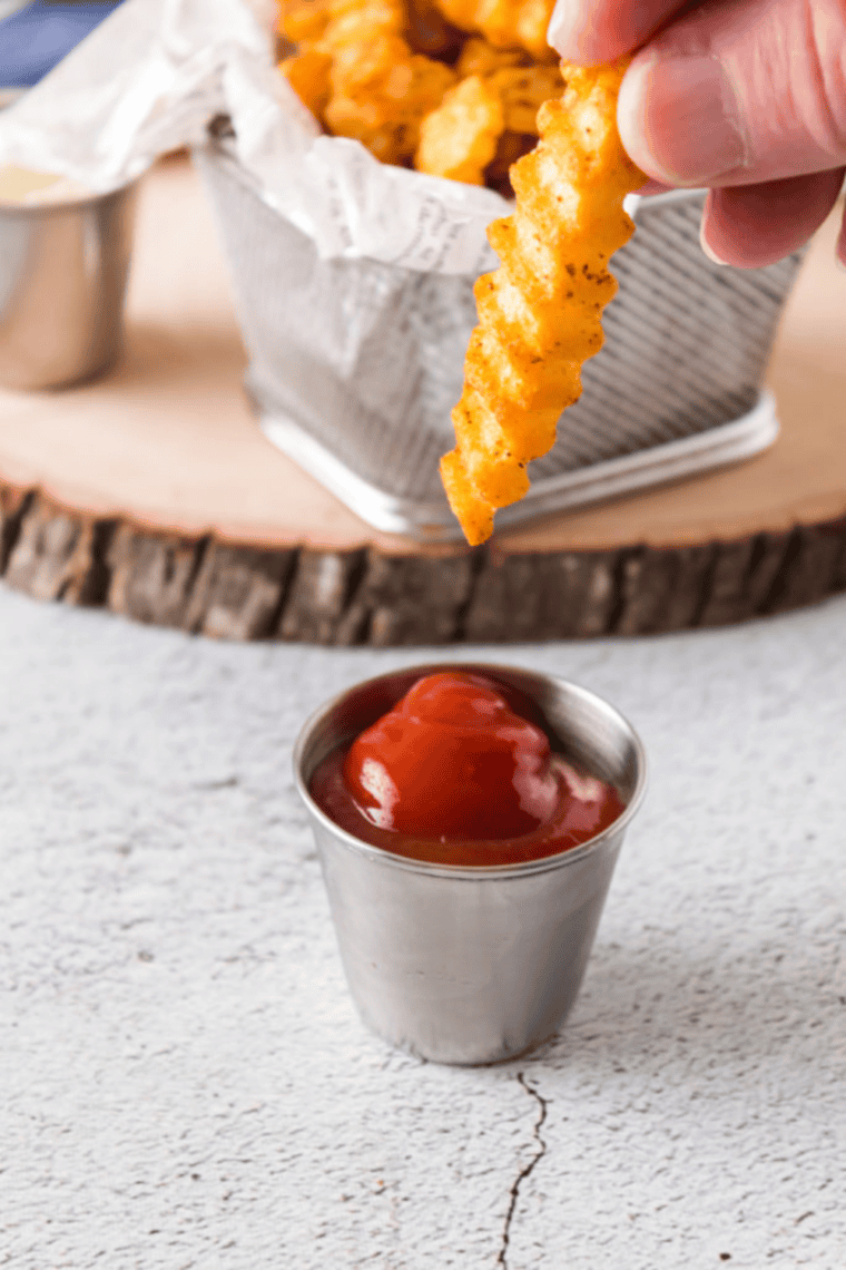 Basket of golden crinkle cut fries cooked until crispy, inspired by Shake Shack style fries with ridged texture.