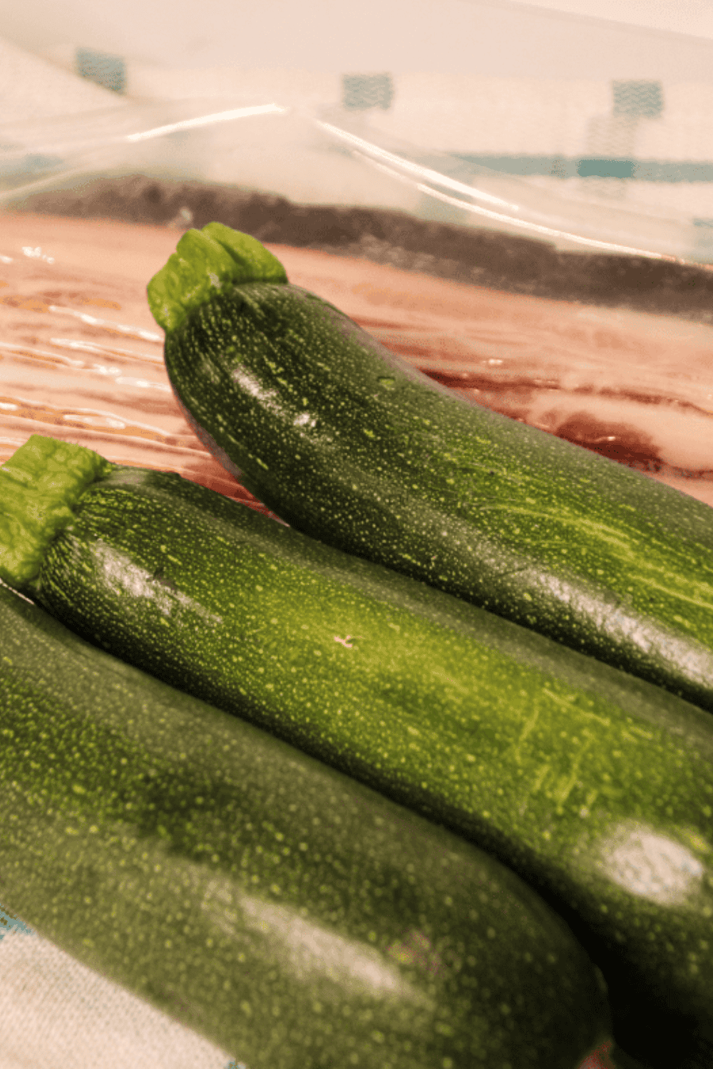 Ingredients needed for Easy Air Fryer Bacon Wrapped Zucchini on kitchen table.