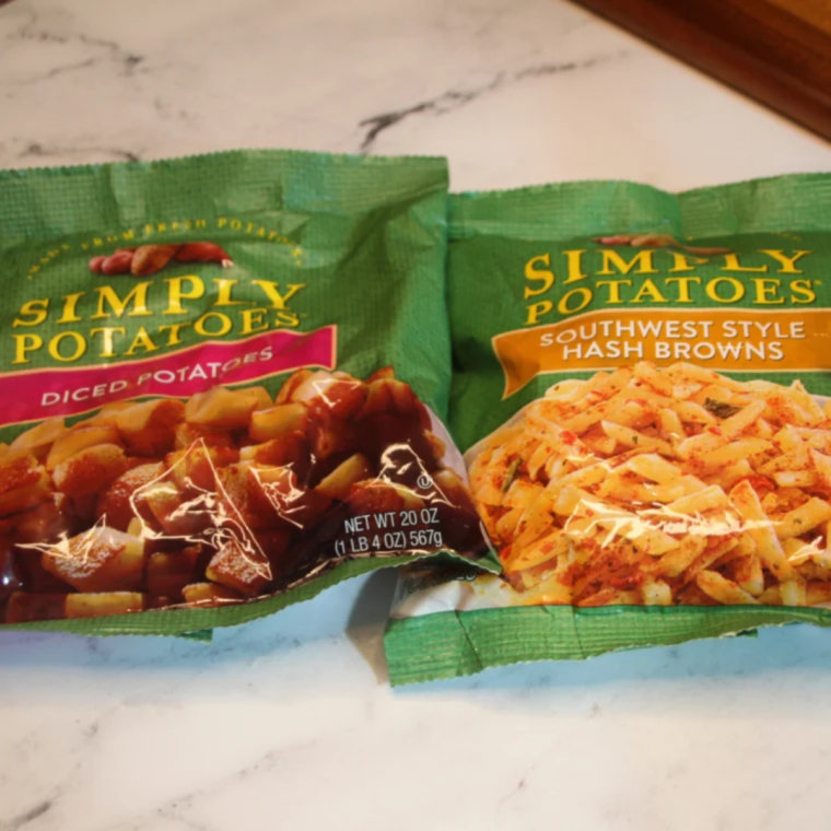 Simply Potatoes diced potatoes and shredded hash browns packages side by side