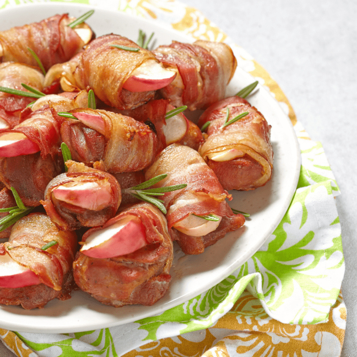 Crispy Air Fryer Apple Cinnamon Bacon Bites with apples coated in cinnamon and wrapped in bacon