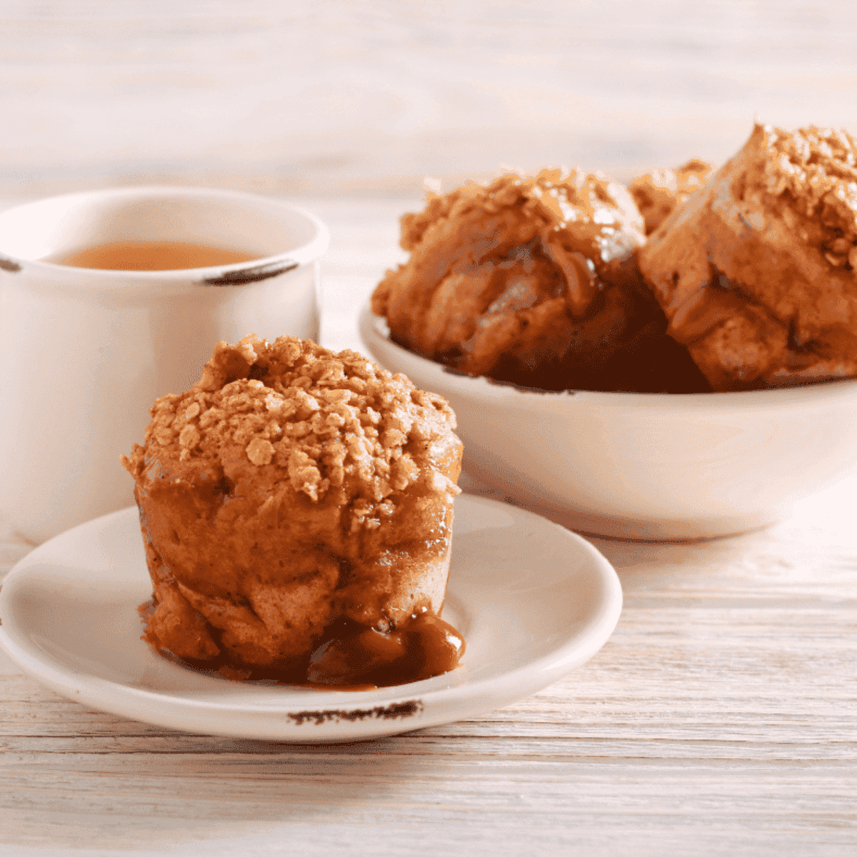 Golden air fryer caramel apple muffins with tender apple chunks and caramel drizzle, freshly baked and ready to enjoy.