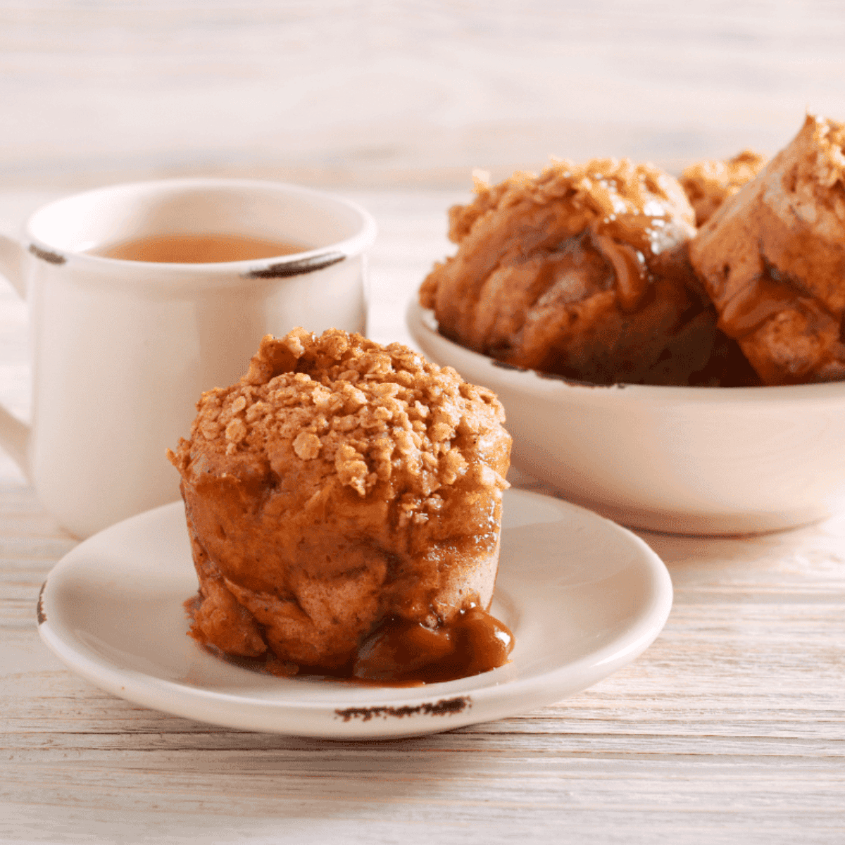 Air frying caramel apple muffins in air fryer basket until golden and cooked through