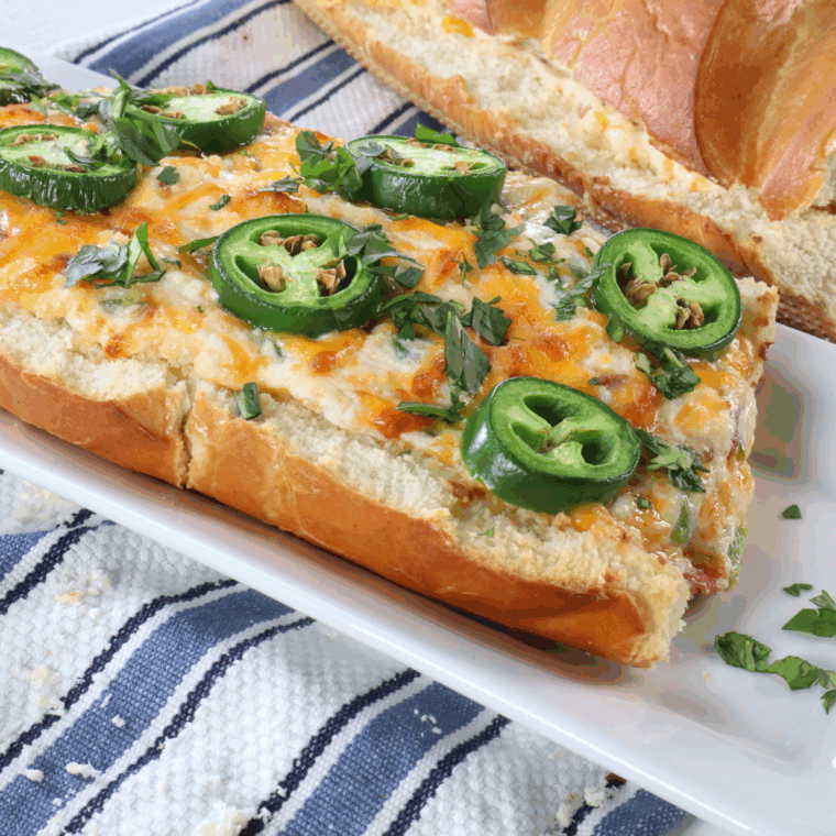 Air fryer jalapeño popper stuffed bread sliced and cheesy