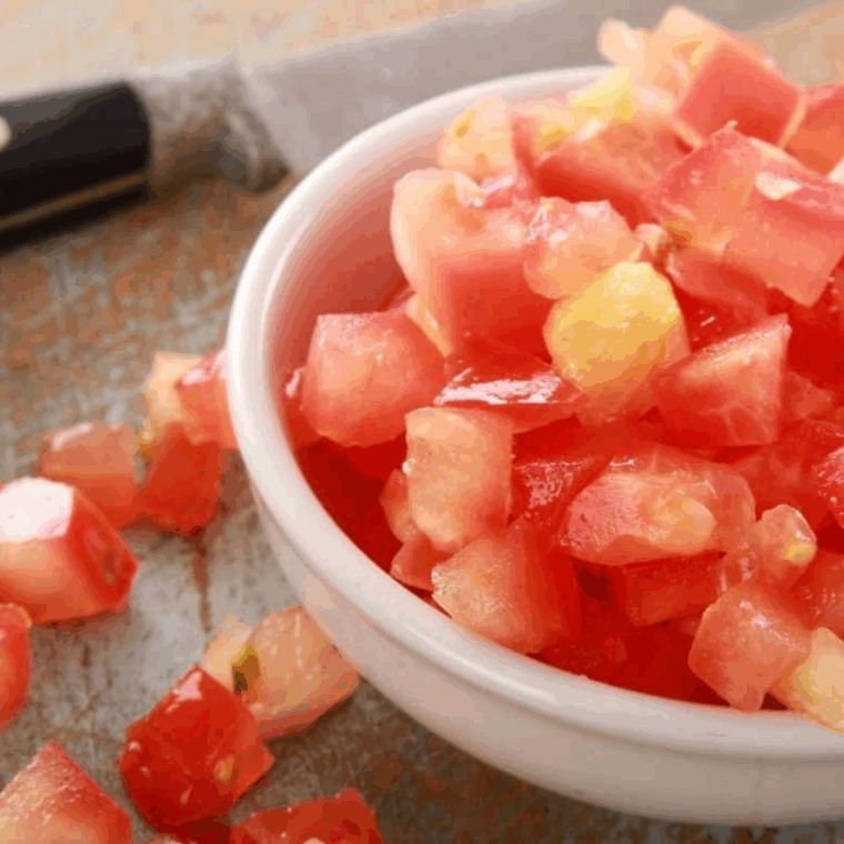 cut tomatoes and buffalo mozzarella into small dice in bowl