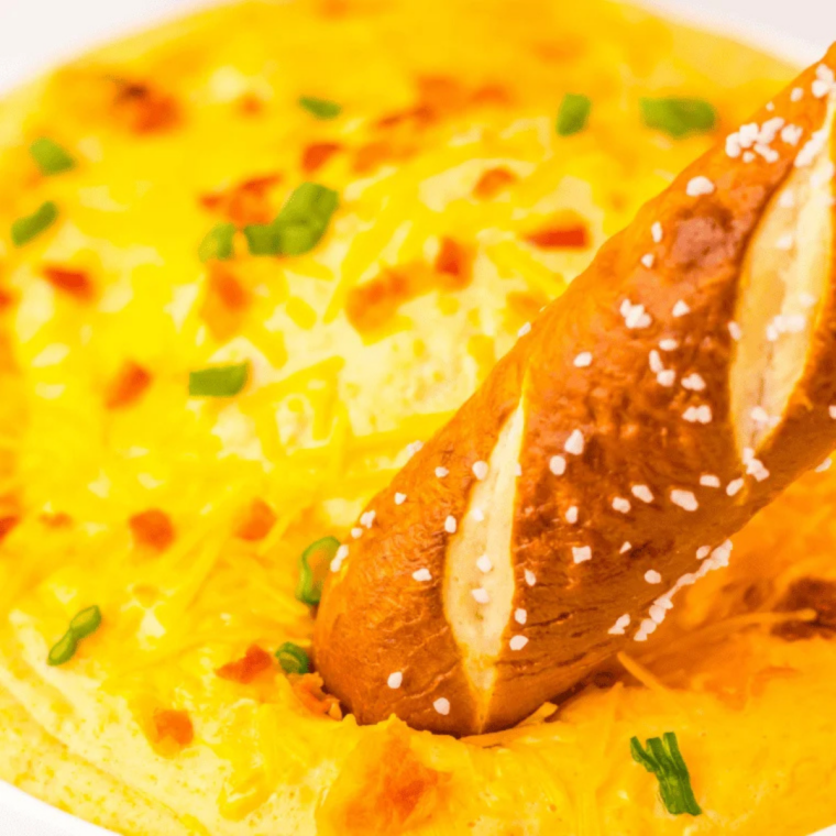 Honey whisked into Dijon mustard beside the finished pretzels and dip