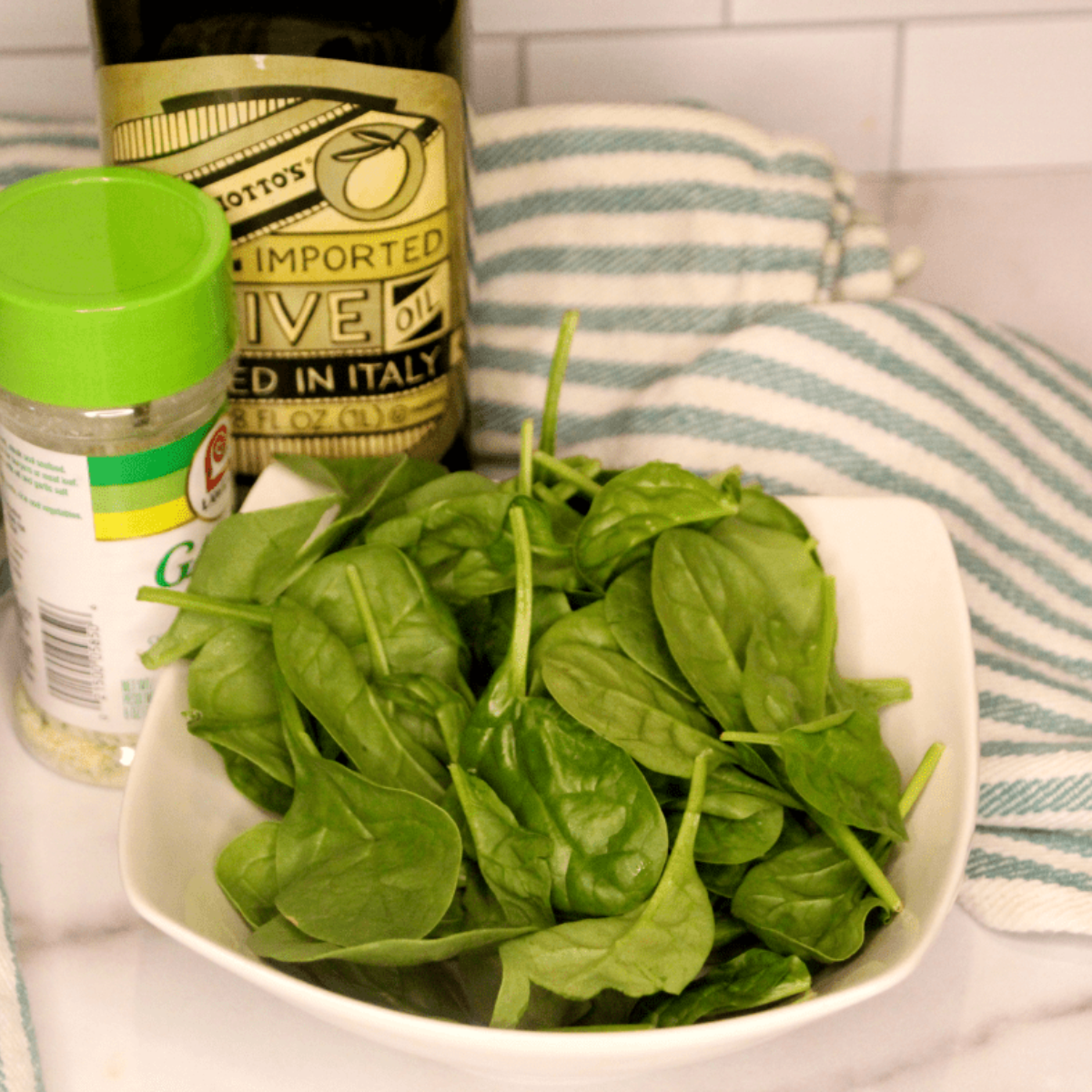 Ingredients needed for Air Fryer Spinach chips on kitchen table.