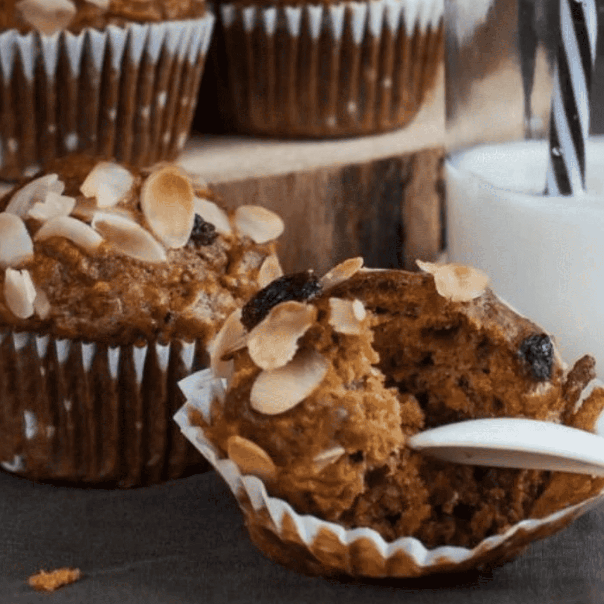Silicone muffin cups filled with batter inside the air fryer basket before cooking