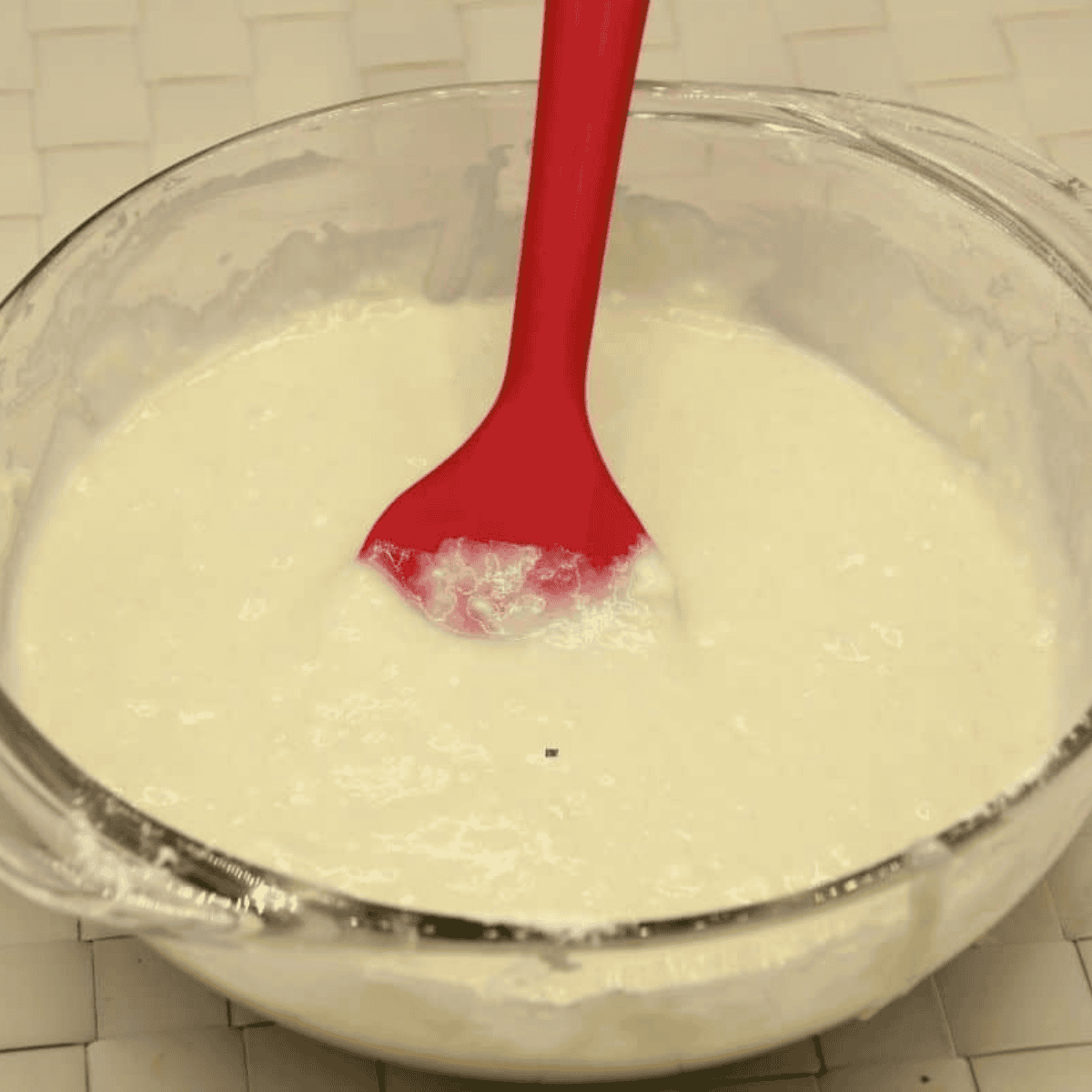Whisking whole wheat flour, oats, cinnamon, and ginger together in a large mixing bowl