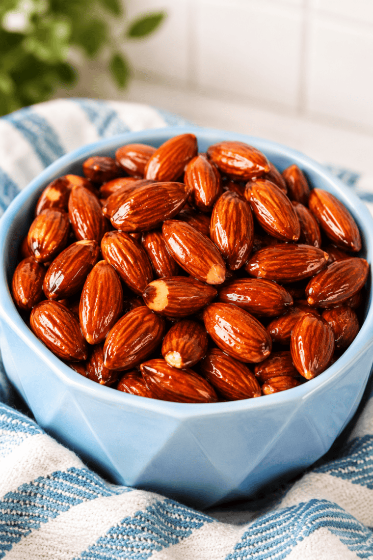 Bowl of glossy honey roasted almonds made in the air fryer