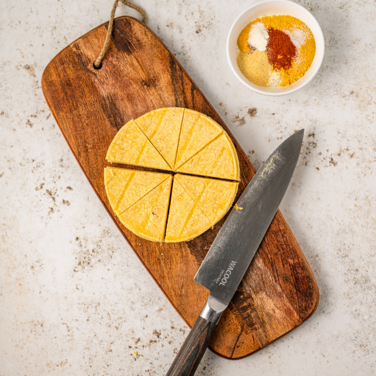 Flour tortillas cut into six wedges on a cutting board
