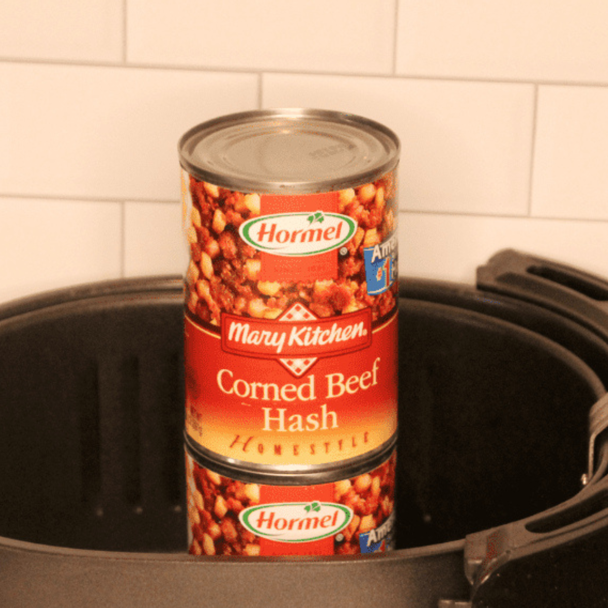 Ingredients needed for Cooking Canned Corned Beef Hash In Air Fryer on kitchen table in air fryer basket.