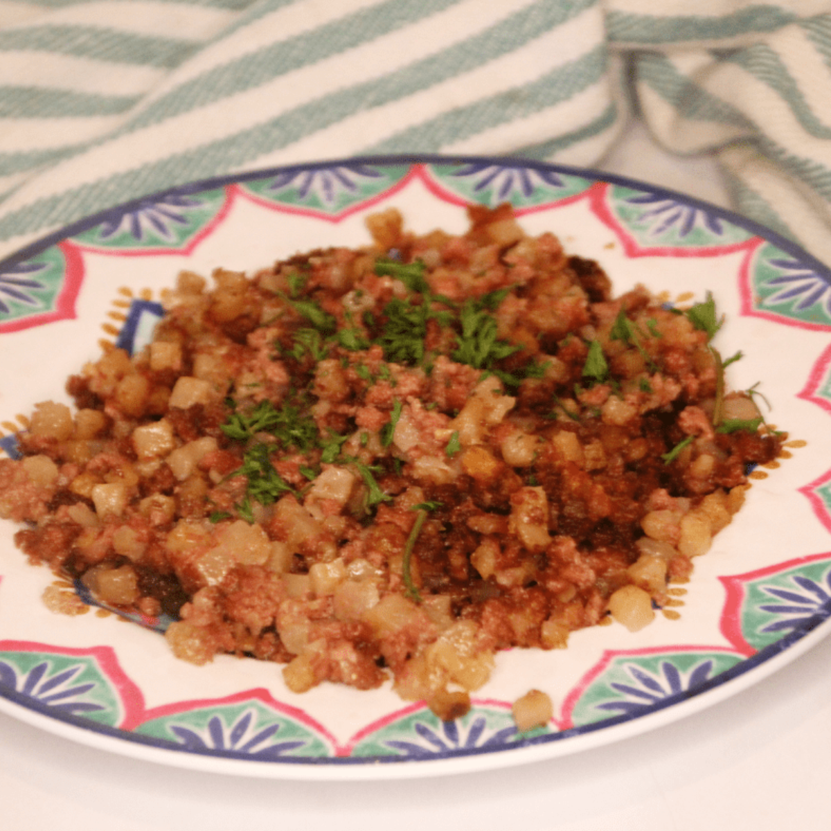 Golden crispy canned corned beef hash served on plate