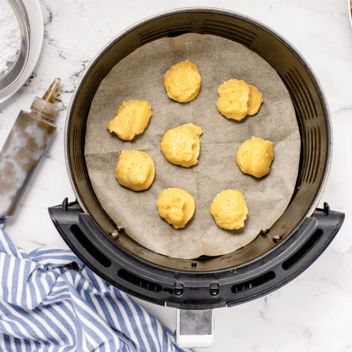 Place the Sufganiyot (Israeli Donuts) into the air fryer basket.