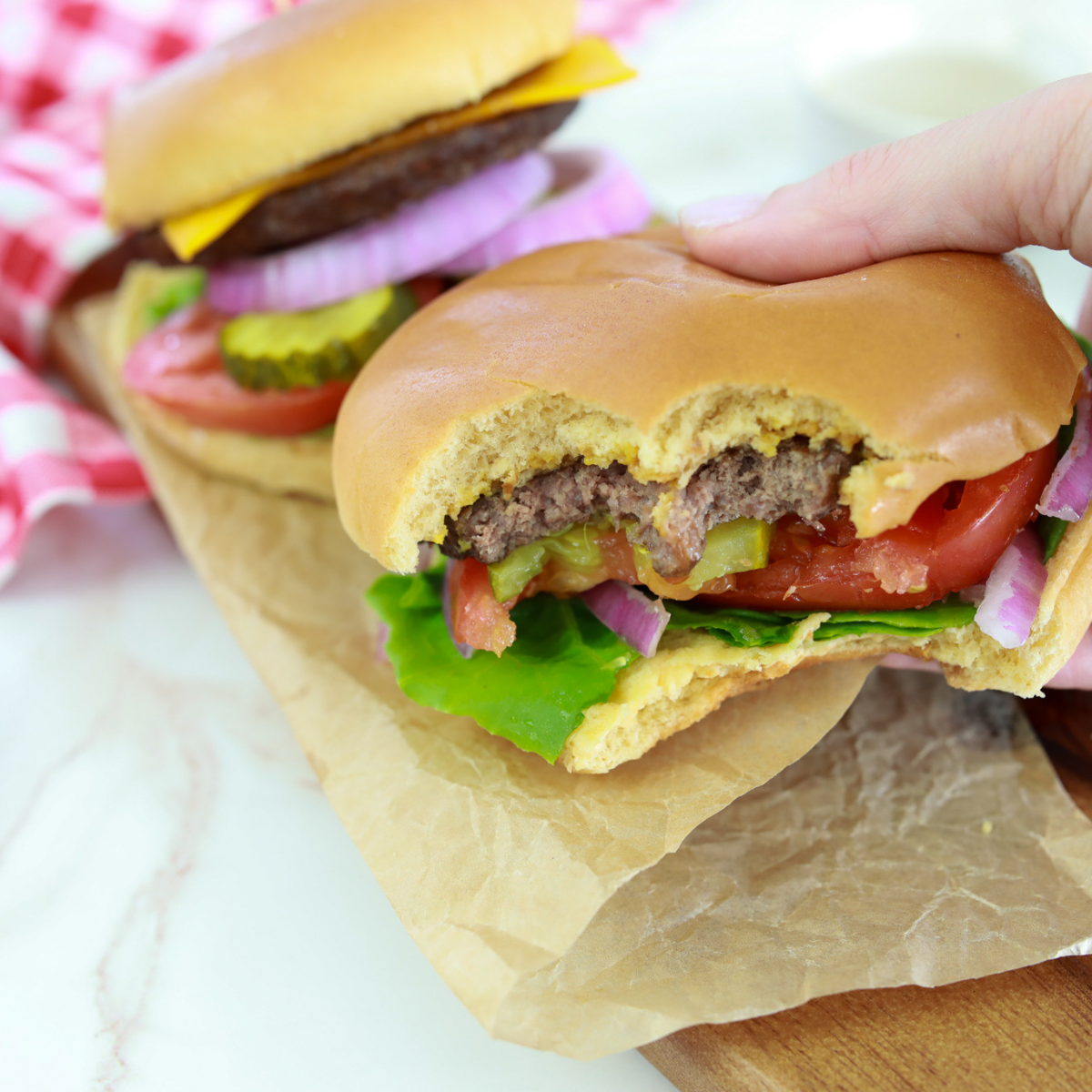 Juicy air fryer Bubba Burger with lettuce, tomato, and toasted bun served on plate