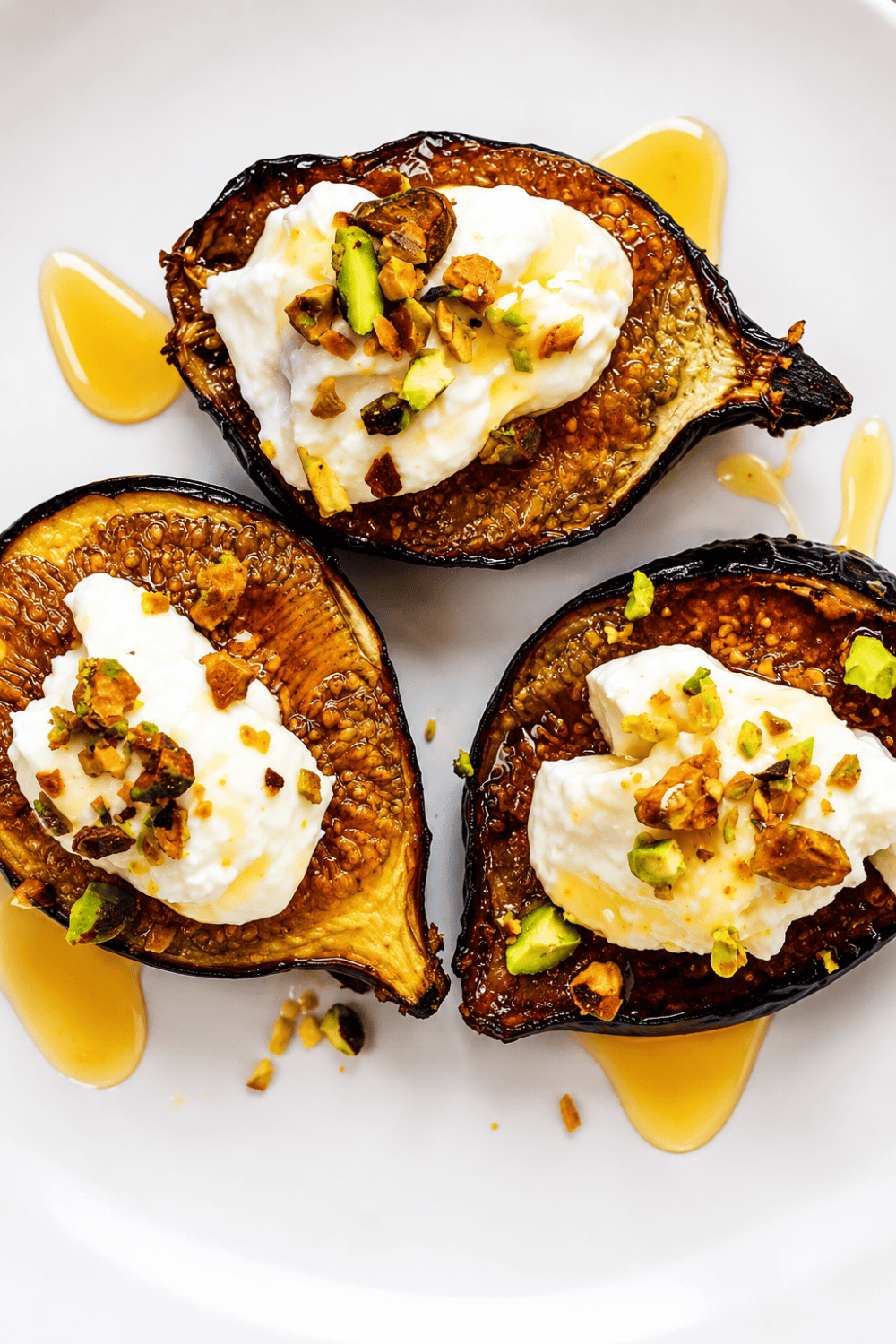 Warm caramelized air fryer figs and honey spooned over French toast topped with whipped cream