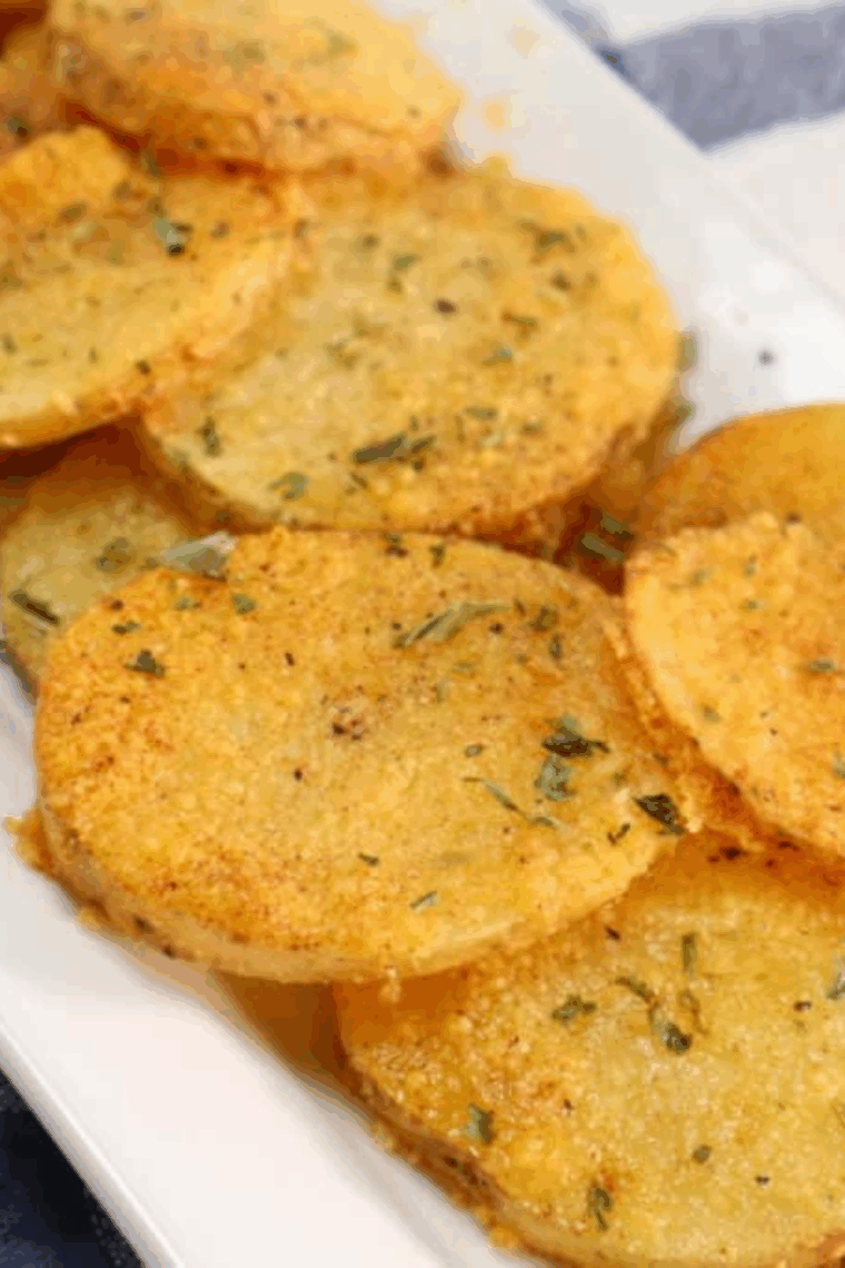 golden air fryer sliced potatoes on plate 