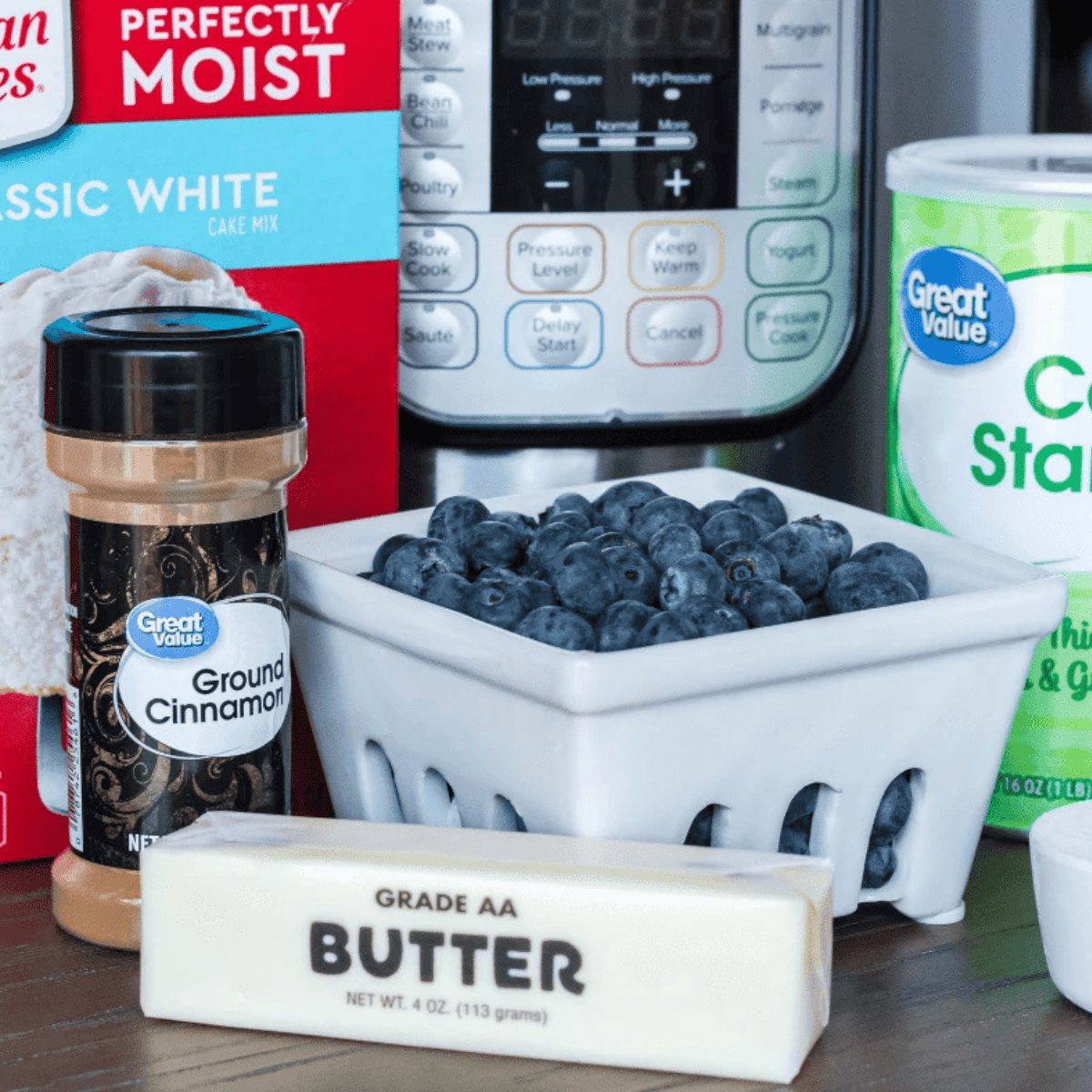 Ingredients needed for Easy Instant Pot Blueberry Cake on kitchen table.