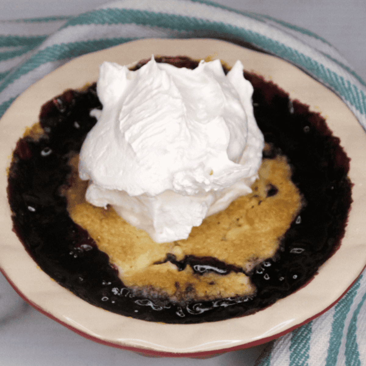 Easy Air Fryer Blueberry Dump Cake with golden cake topping and juicy blueberries.