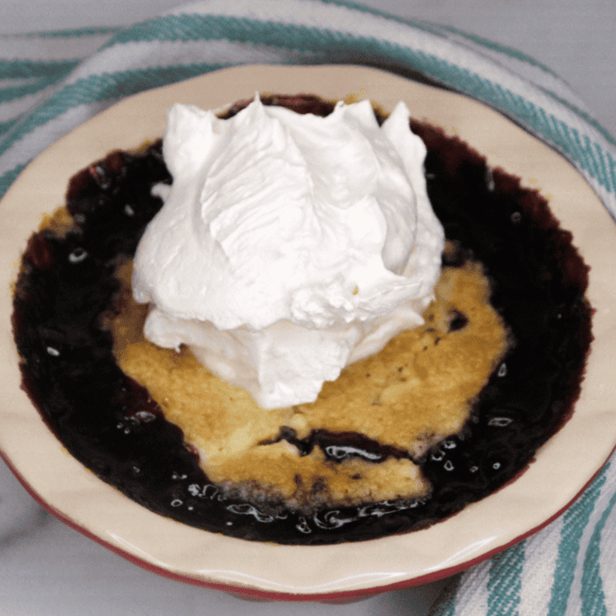 Air Fryer Blueberry Dump Cake with juicy blueberries, cake mix, and butter, golden and crispy.