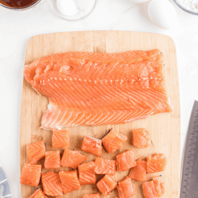 Salmon fillets cut into bite-sized chunks, coated evenly with teriyaki glaze