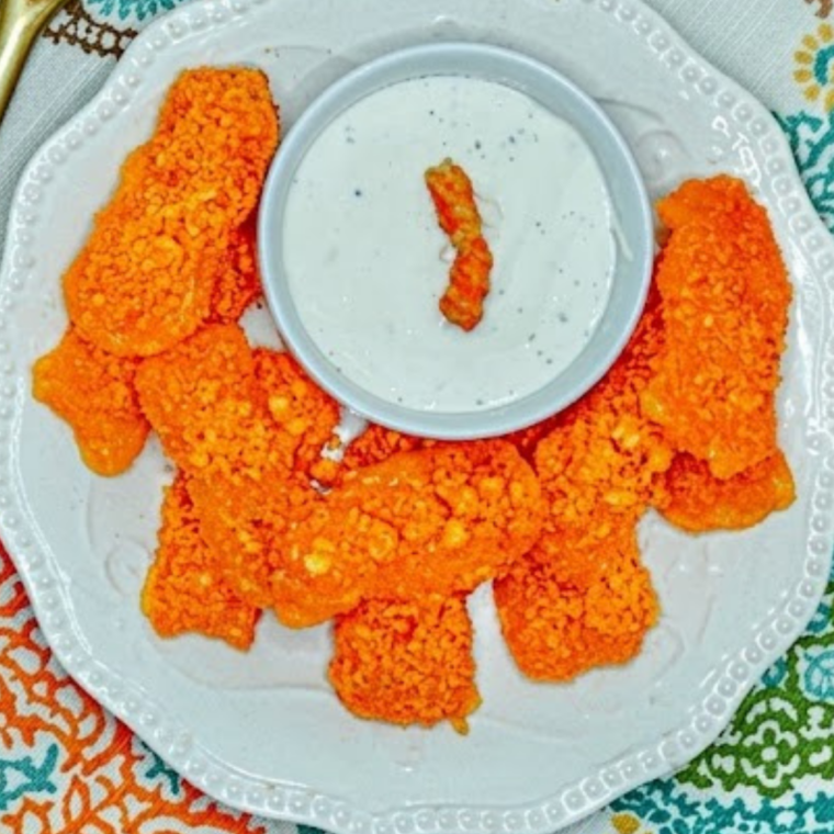 Air fryer Cheetos coated mozzarella sticks golden crispy cheesy snack with melted cheese pull inside.