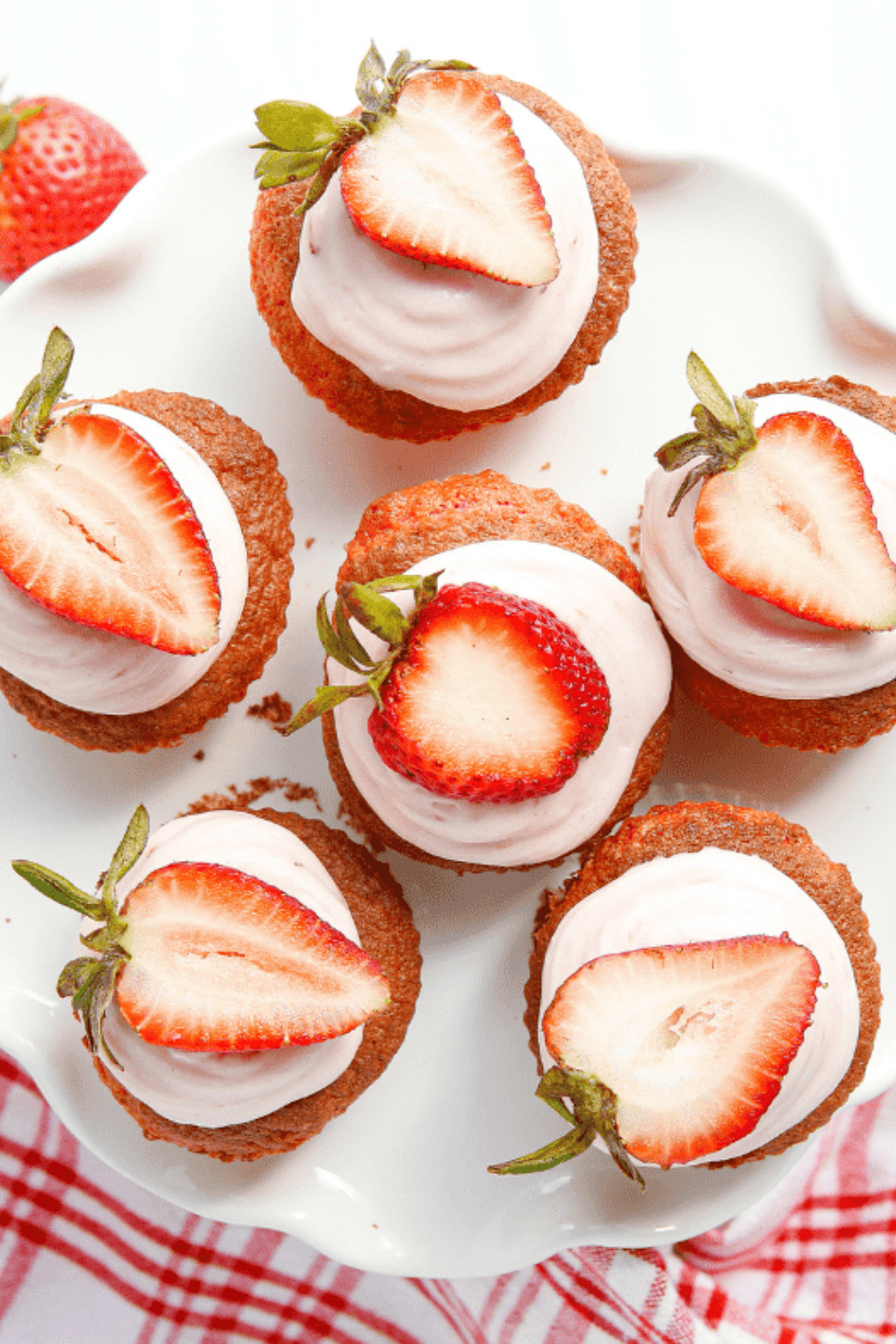 Finished strawberry cupcakes arranged on a plate, ready to store or serve.