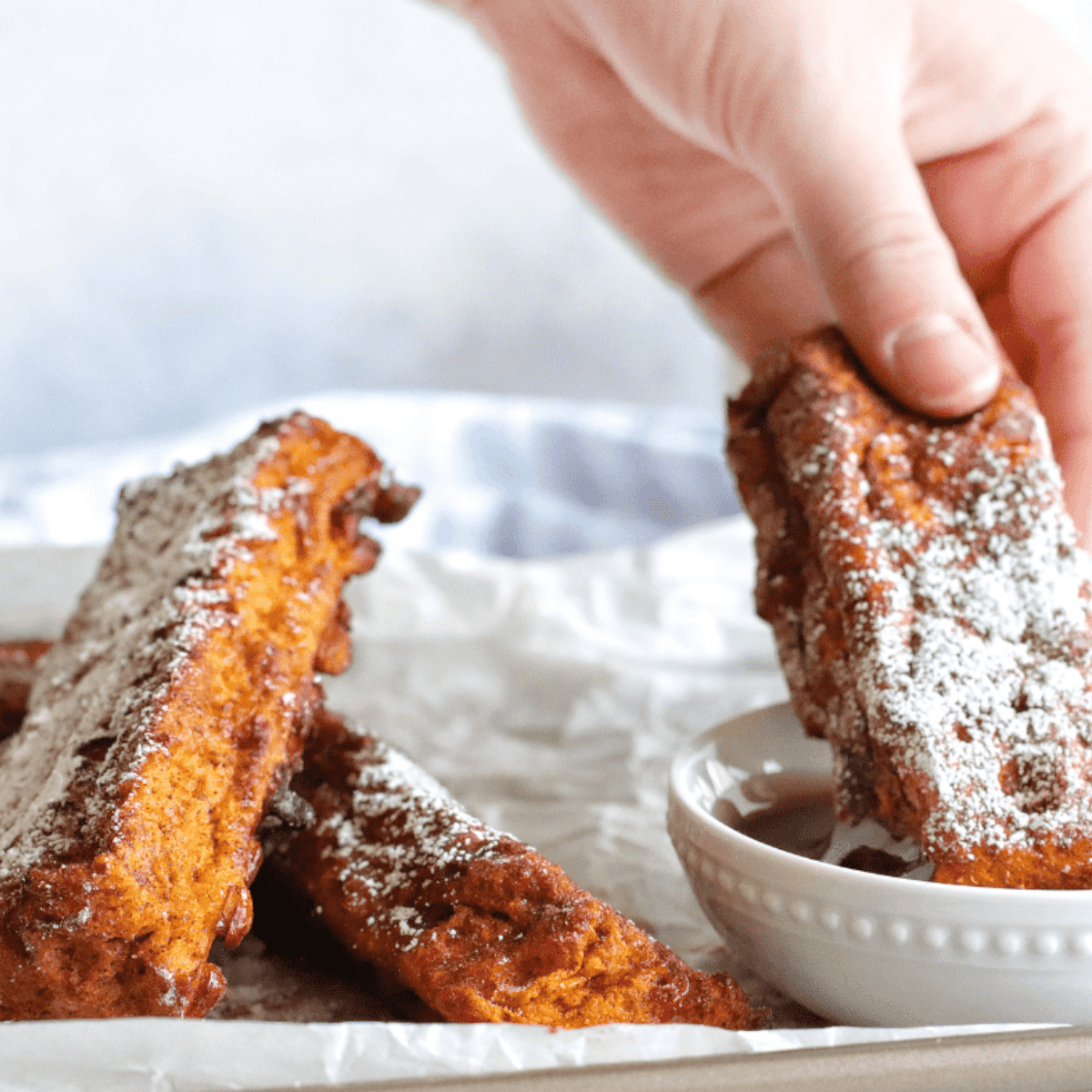 Golden Ninja Foodi French Toast slices on a plate with syrup"